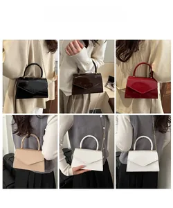Detail shots of minimalist glossy crossbody bags in five colors with triangle envelope flap