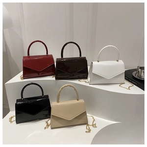 Five glossy patent leather small square bags in various colors with gold chain straps