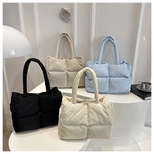 Quilted down cotton tote bags displayed in black, khaki, blue, and cream white colors