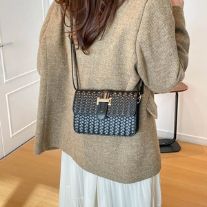 Classic black woven crossbody bag with elegant gold H-shaped buckle for stylish women