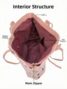 Pink corduroy tote bag interior showing zipper pocket, slip pocket and strawberry pattern
