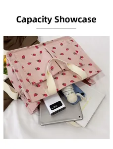 Detailed view of pink corduroy strawberry tote bag showing large storage capacity