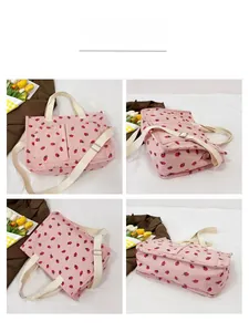 Pink corduroy tote bag with red strawberry pattern shown from four different view angles