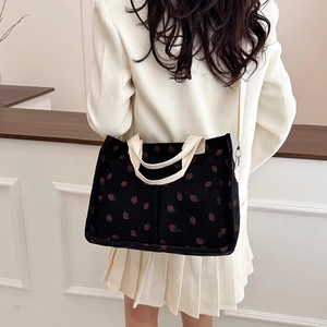 Minimalist black corduroy tote bag with red strawberry embroidery for daily casual use