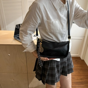 Retro black crescent crossbody bag with golden tennis racket pendant and woven rope