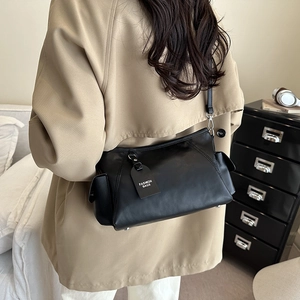 Minimalist black large capacity crossbody bag for women in stylish leather finish