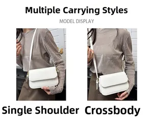 Détails d'un sac à rabat blanc minimaliste avec bandoulière réglable et boucles dorées