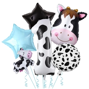 Detail view of cow print number one balloon and cartoon cow head foil balloon set