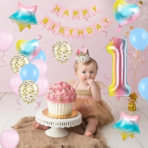 Rainbow gradient balloon set with Happy Birthday banner and crown for 1st birthday party