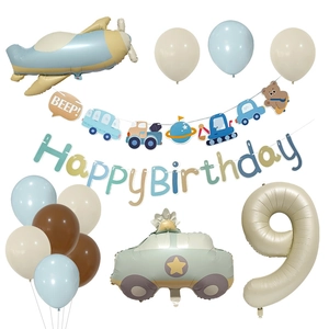 Detail of 9th birthday party kit with plane, car, and number nine foil balloons