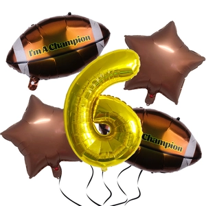 Close-up of Super Bowl theme balloon set with gold number 6 and brown football shapes