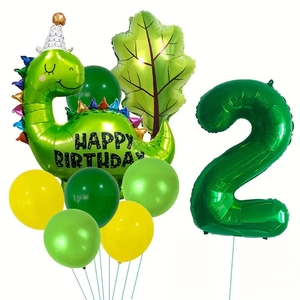 Détail du kit 2ème anniversaire avec dinosaure vert, ballon chiffre 2 et feuille de palmier