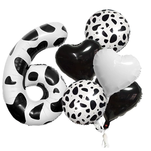 Detail of 40-inch cow print number 6 balloon set with heart and round foil balloons