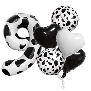 Detail of 40-inch cow print number 9 balloon set with black and white heart foil balloons