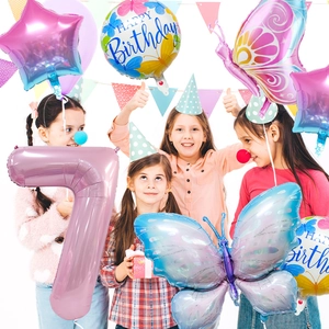 Children celebrating with 40-inch gradient number 7, butterfly, and star foil balloons