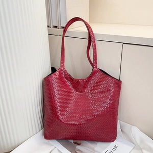 Detailed view of the dark red woven texture on this large capacity tote bag