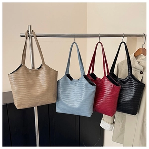 Detail showing woven texture bucket bags in khaki, blue, burgundy and black colors