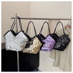 Detail of four sequin tote bags in silver gold purple and black colors with dual straps