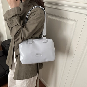 Light blue oil wax leather Boston bag with large capacity and minimalist design