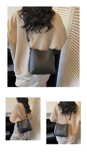 Detail view of black bucket bag with reinforced base and adjustable thin shoulder strap