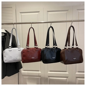 Detailed comparison of four glossy faux leather tote bags in white, brown, black and coffee