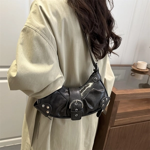 Chic black shiny leather crescent bucket bag with metal buckle and rivets in Y2K style