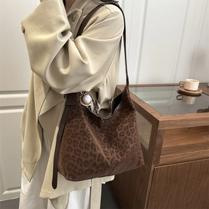 Large leopard print hobo bag in brown suede with leather shoulder strap for winter
