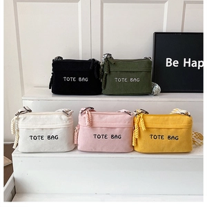 Group display of corduroy tote bags in five colors with stylish patterned wide straps