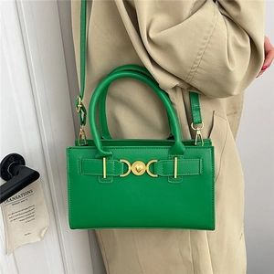 Retro bright green rectangular leather handbag with gold heart buckle and crossbody strap