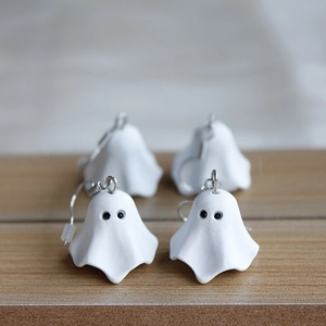 Handmade white ghost drop earrings for Halloween with matte finish and silver hooks