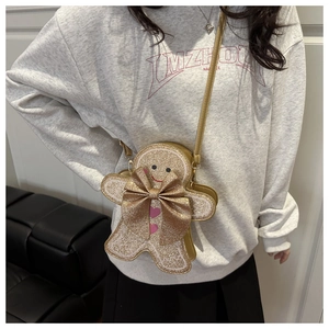 Détail du sac bandoulière bonhomme de pain d'épices avec paillettes dorées et broderie