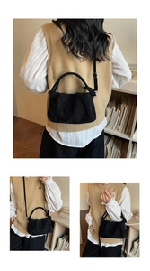 Close-up of black suede cloud bag with soft pleats and silver hardware details