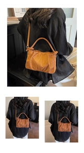 Detailed view of caramel suede pleated cloud bag with adjustable crossbody strap