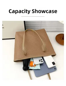 Large woven tote bag capacity display showing tablet, phone and umbrella inside