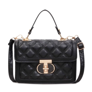 Classic black quilted crossbody bag with gold lock and top handle on white background