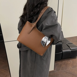 Chic caramel brown tote bag in pebbled leather with a heart pattern scarf decoration