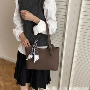 Minimalist dark brown leather tote bag for women with decorative heart print scarf accessory