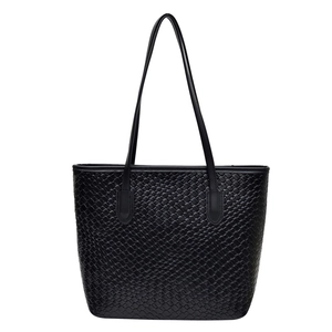 Classic black woven leather tote bag with minimalist shoulder straps in large capacity size