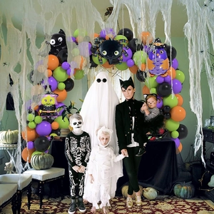Halloween balloon arch with purple, green, orange balloons, spider and bat foil balloons