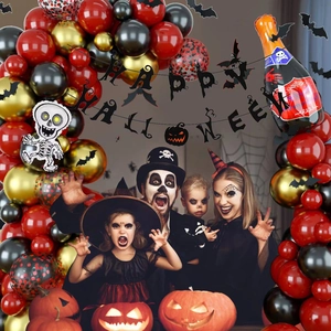 Halloween balloon arch kit with red, black and gold balloons, skull and bottle foil decor