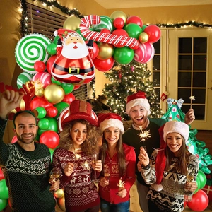 Close-up of Santa and candy cane foil balloons in a festive red and green garland kit