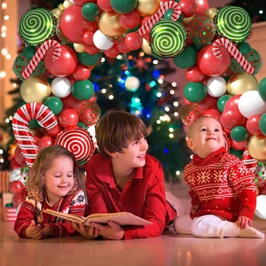 Christmas balloon arch kit with candy canes and latex balloons in festive room setting