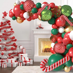 Christmas balloon arch kit with candy cane foils around a festive white fireplace