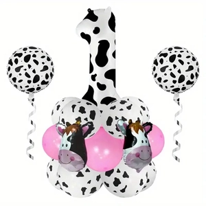 Detail of cow print number 1 and cow head foil balloons for first birthday party decor