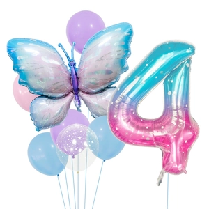 Detail of starry gradient butterfly and number 4 balloons for themed party decoration