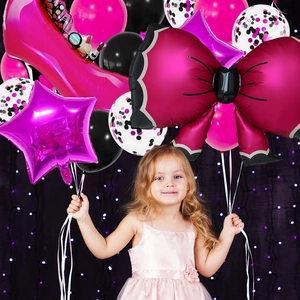 Detailed view of large hot pink stiletto and bow balloons for princess party decor