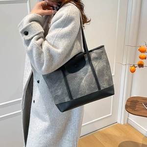 Retro grey canvas tote bag with black leather straps and trim for women's daily commute