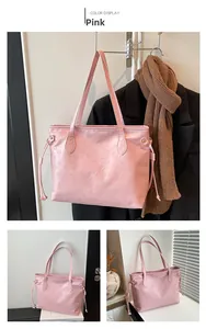 Detail of pink tote bag with embossed cartoon bear patterns and side drawstring design