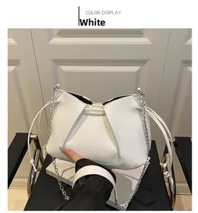 Detail of white pleated matte PU leather tote with silver chain and drawstring strap