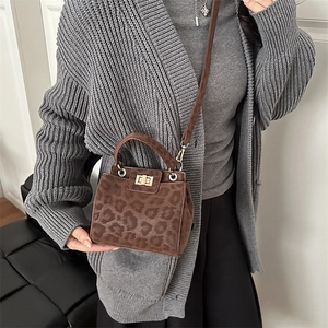 Chic leopard print mini handbag with gold twist lock and crossbody strap for women